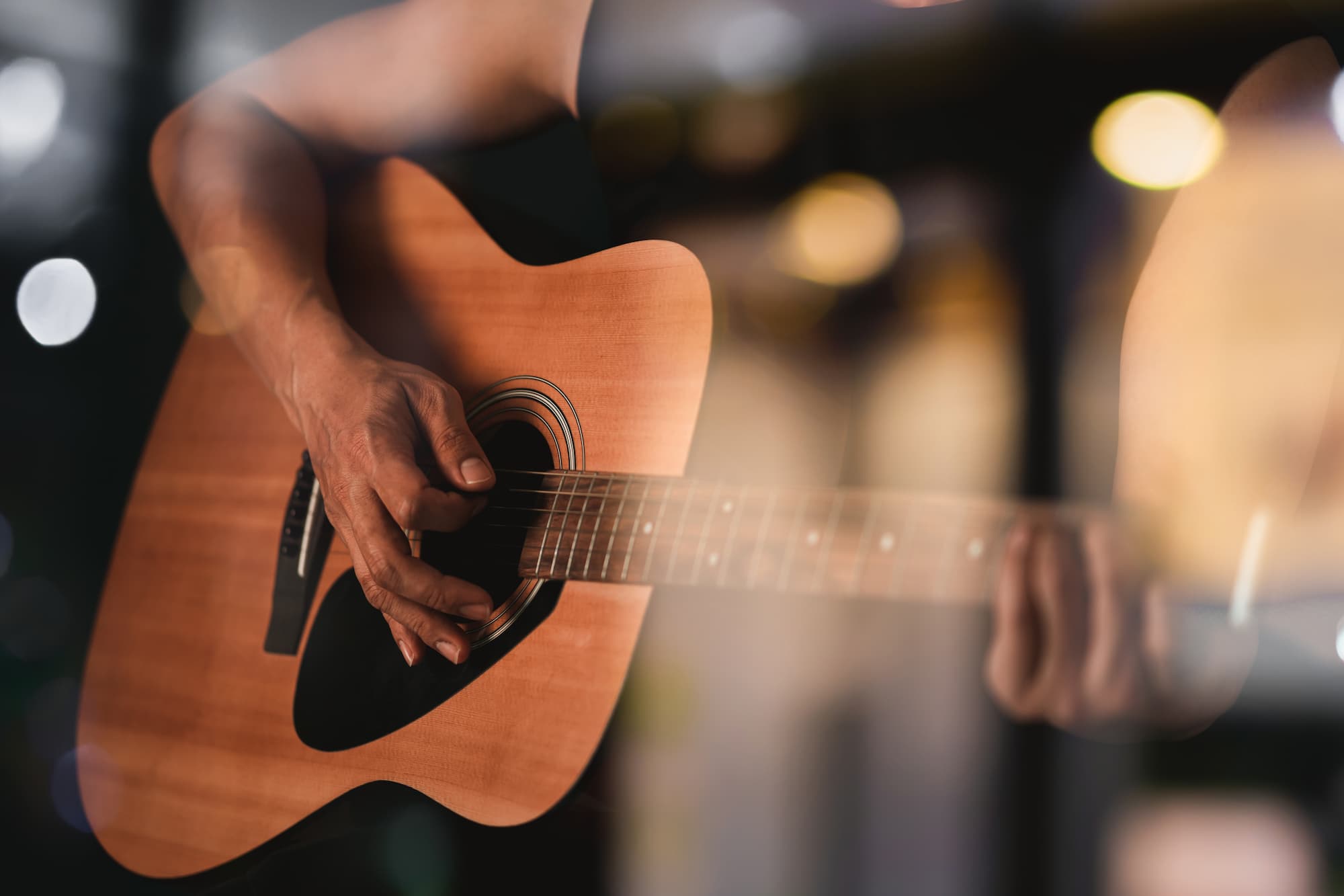 close-up-of-guitar-player Close up of a man playing a guitar